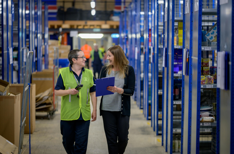 Two women working in a warehouse